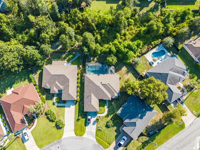 an aerial view of residential houses with outdoor space