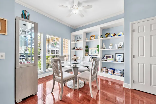 a dining room with furniture water view and a window