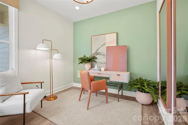 a room with furniture and a potted plant