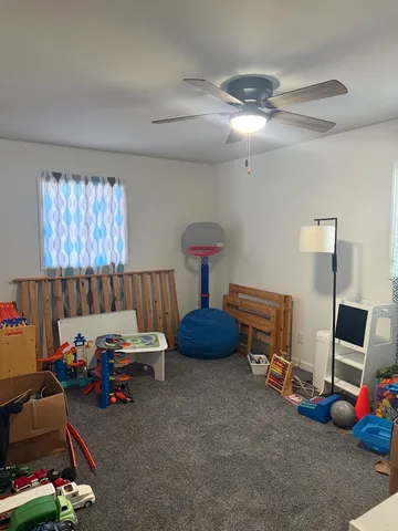 a bedroom with furniture and a window