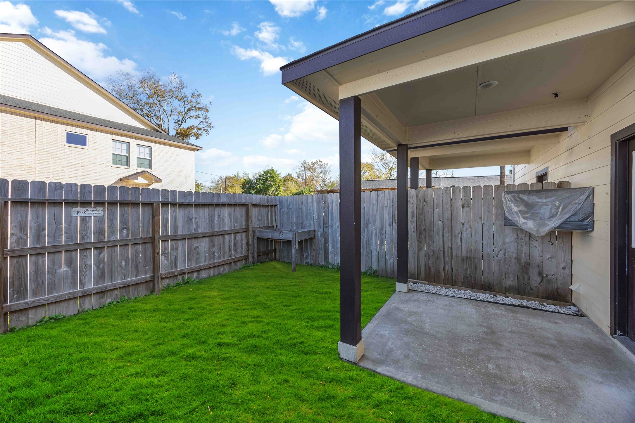 4903 Mallow Street, Unit A Houston, TX 77033 - Photo 10 of 10 A small private backyard and a covered patio area attached to the house.