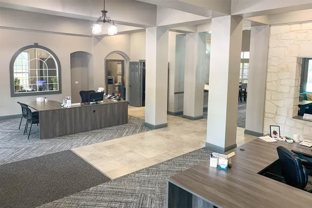 a view of a livingroom with furniture window and wooden floor