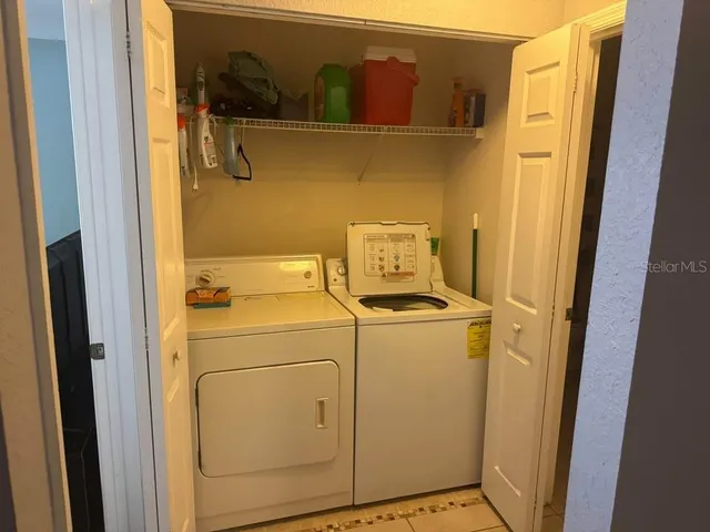 a utility room with dryer and washer