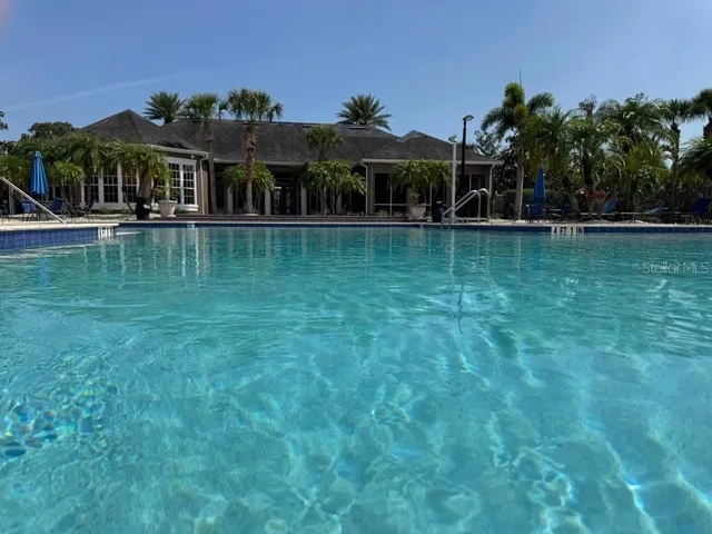 a view of house with swimming pool and outdoor space