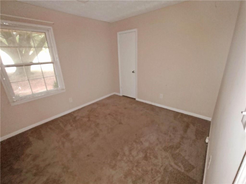 497 Highway 212 Covington, GA 30016 - Photo 7 of 14 an empty room with a window