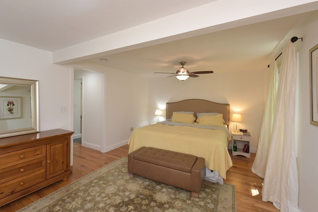 31 Elm Street Upton, MA 01568 - Photo 14 of 33 a bedroom with a bed and a dresser