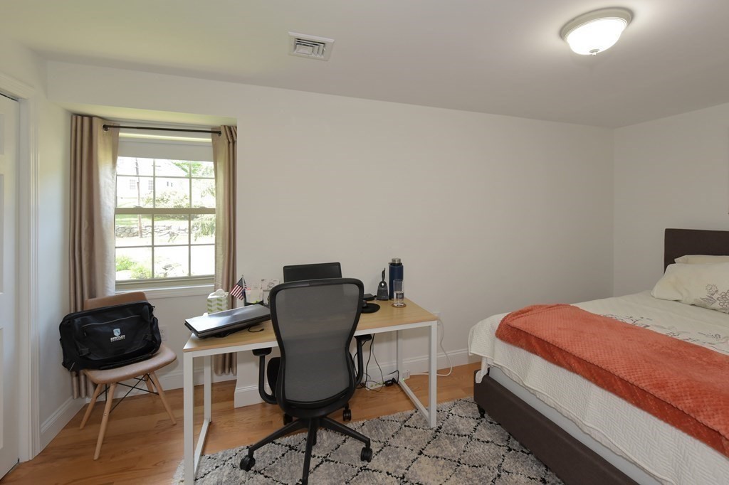 31 Elm Street Upton, MA 01568 - Photo 18 of 33 a bedroom with a chair and a window