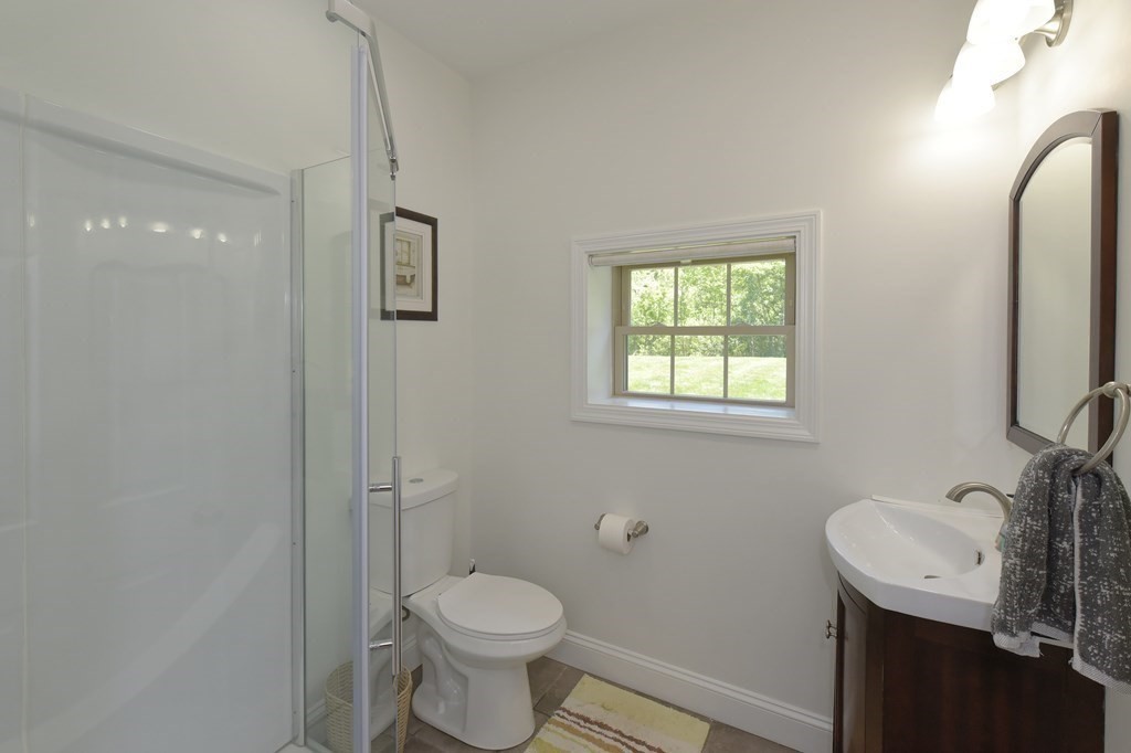 31 Elm Street Upton, MA 01568 - Photo 22 of 33 a bathroom with a sink toilet and a mirror