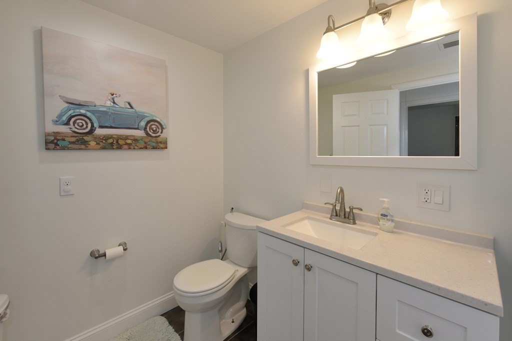 31 Elm Street Upton, MA 01568 - Photo 23 of 33 a bathroom with a toilet sink and mirror