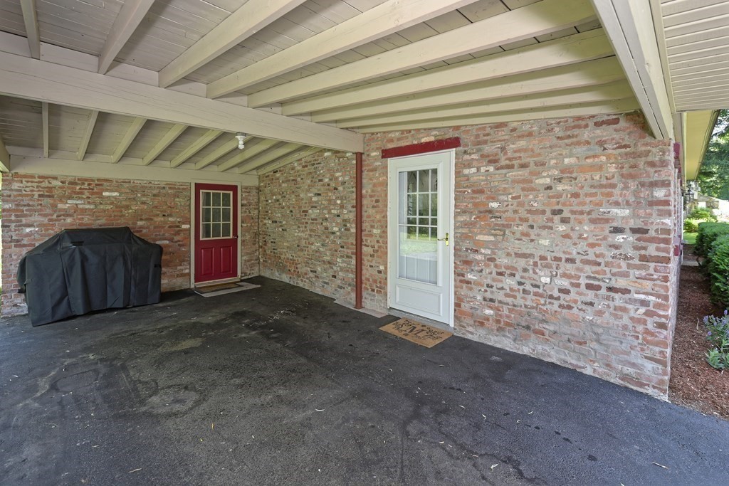 31 Elm Street Upton, MA 01568 - Photo 27 of 33 a view of empty room with fireplace and fan