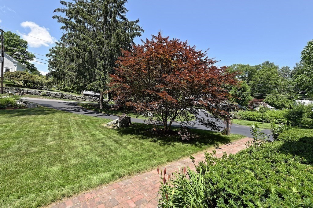 31 Elm Street Upton, MA 01568 - Photo 32 of 33 a backyard of a house with a yard and outdoor seating