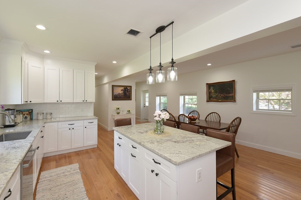 31 Elm Street Upton, MA 01568 - Photo 6 of 33 a kitchen with granite countertop a sink a counter space appliances and cabinets