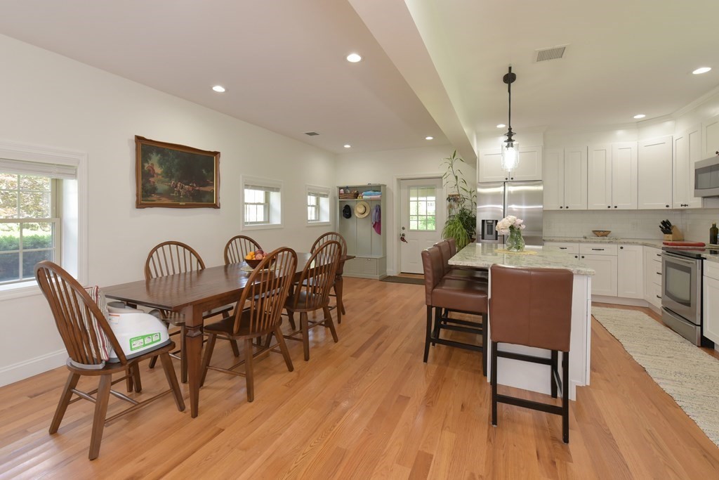 31 Elm Street Upton, MA 01568 - Photo 8 of 33 a view of a dining room with furniture and wooden floor