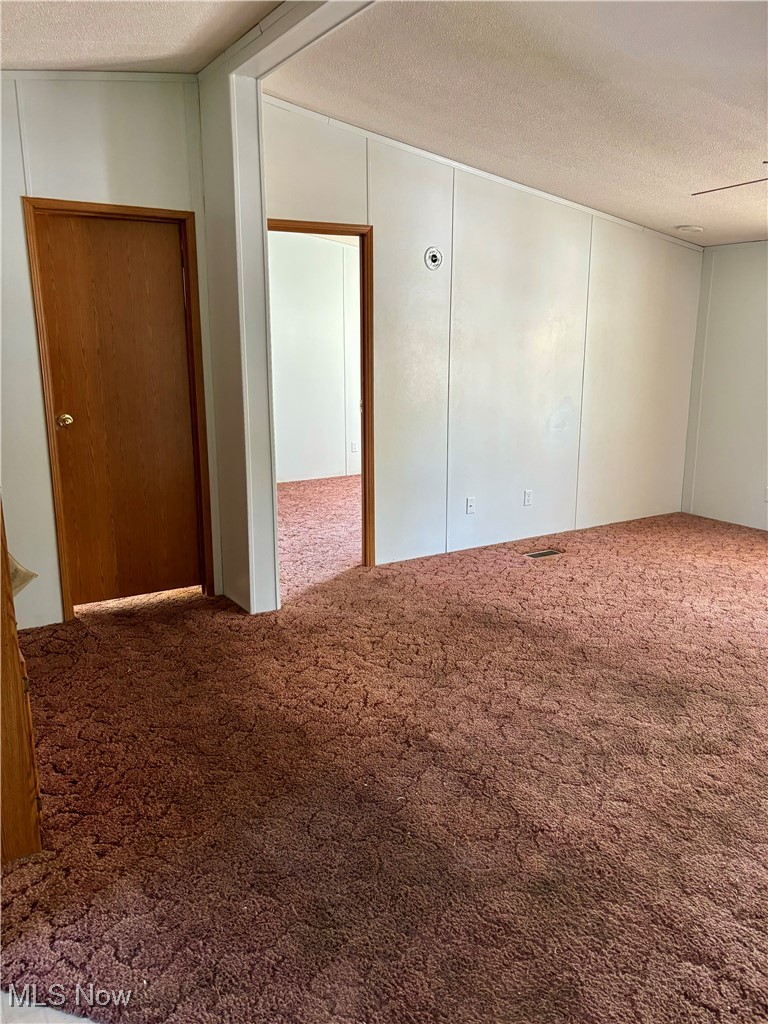35 Sand Ridge Road Zanesville, OH 43701 - Photo 27 of 28 Empty room with carpet floors and a textured ceiling