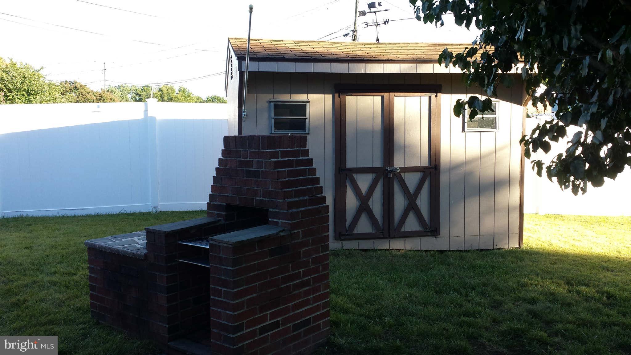 1514 Cavel Road Baltimore, MD 21237 - Photo 7 of 25 Shed and brick barbecue