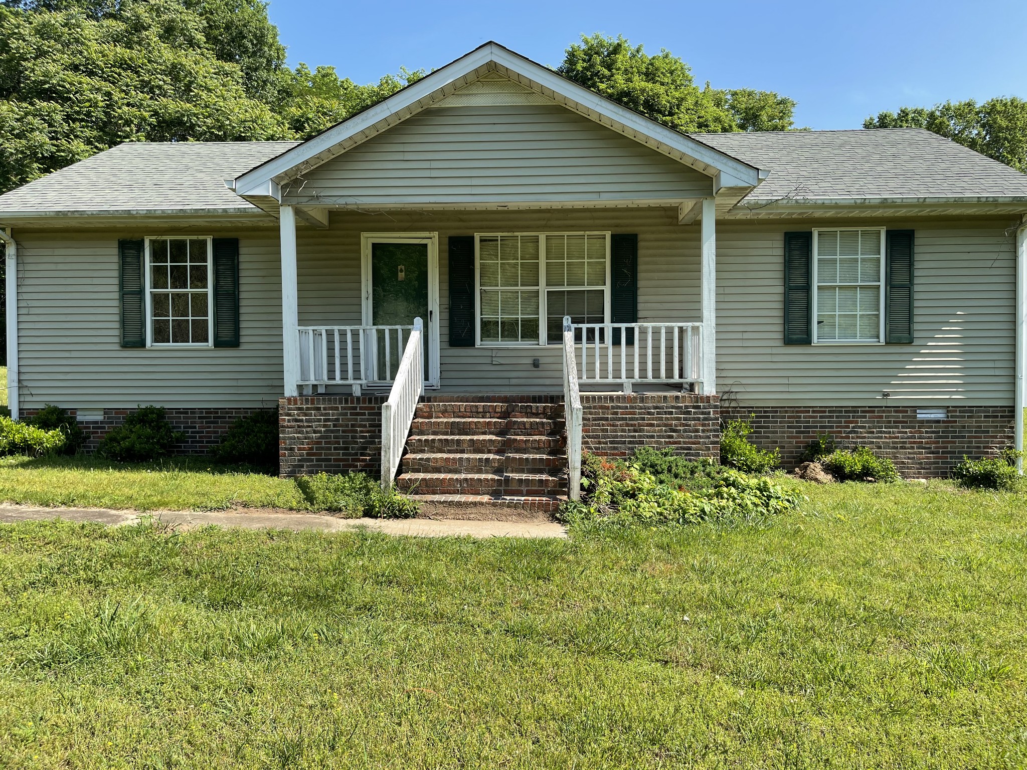 232 Old Walls Road Pulaski, TN 38478 - Photo 1 of 22 a front view of a house with garden