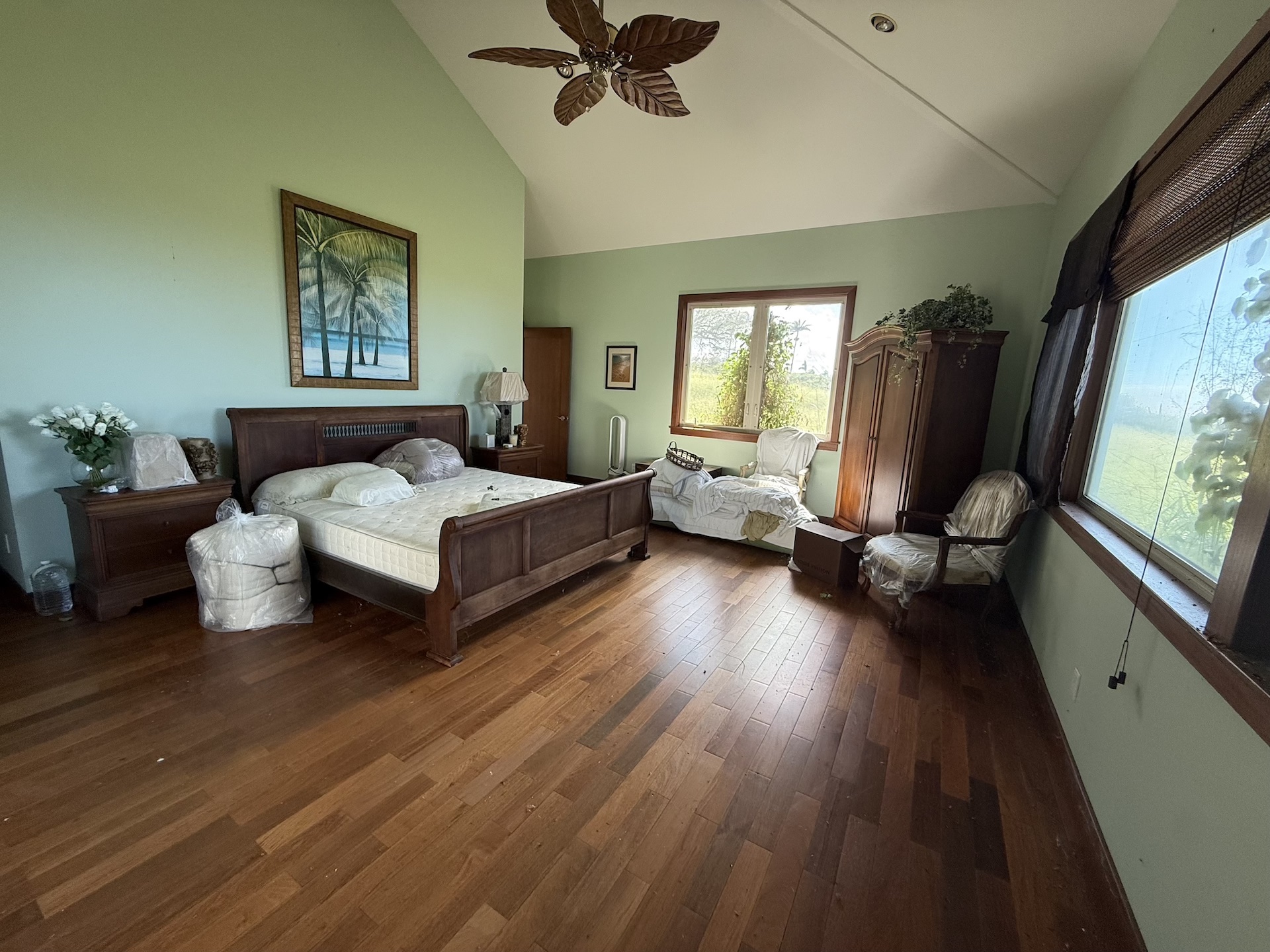 56-2962 Puakea Bay Road Kamuela, HI 96743 - Photo 3 of 5 a living room with a bed furniture and a large window