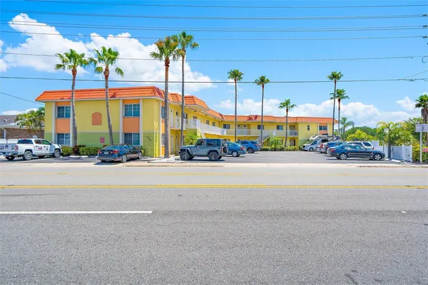 a view of building with cars