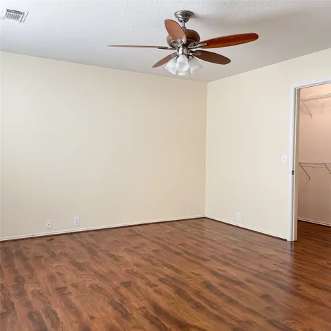 a view of a big room with wooden floor