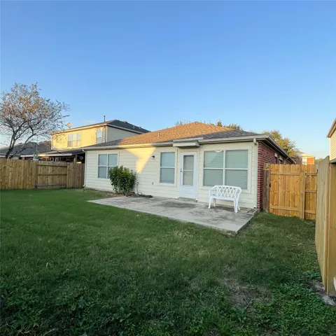 a front view of a house with a yard and porch