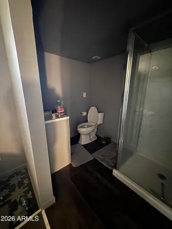 a bathroom with a glass door shower