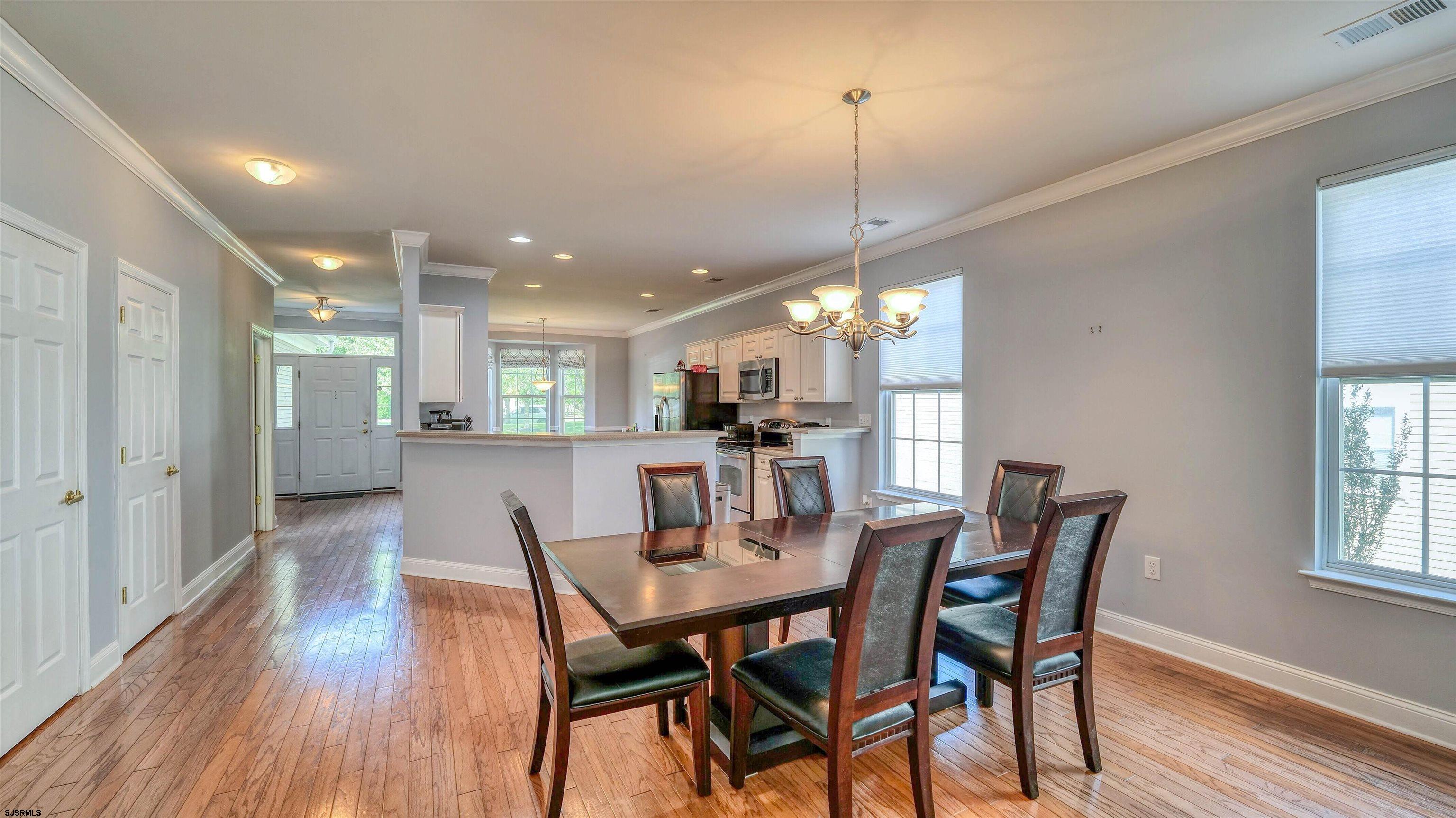 30 Wordsworth Street Galloway Township, NJ 08205 - Photo 11 of 30 a view of a dining room and livingroom with furniture wooden floor a chandelier