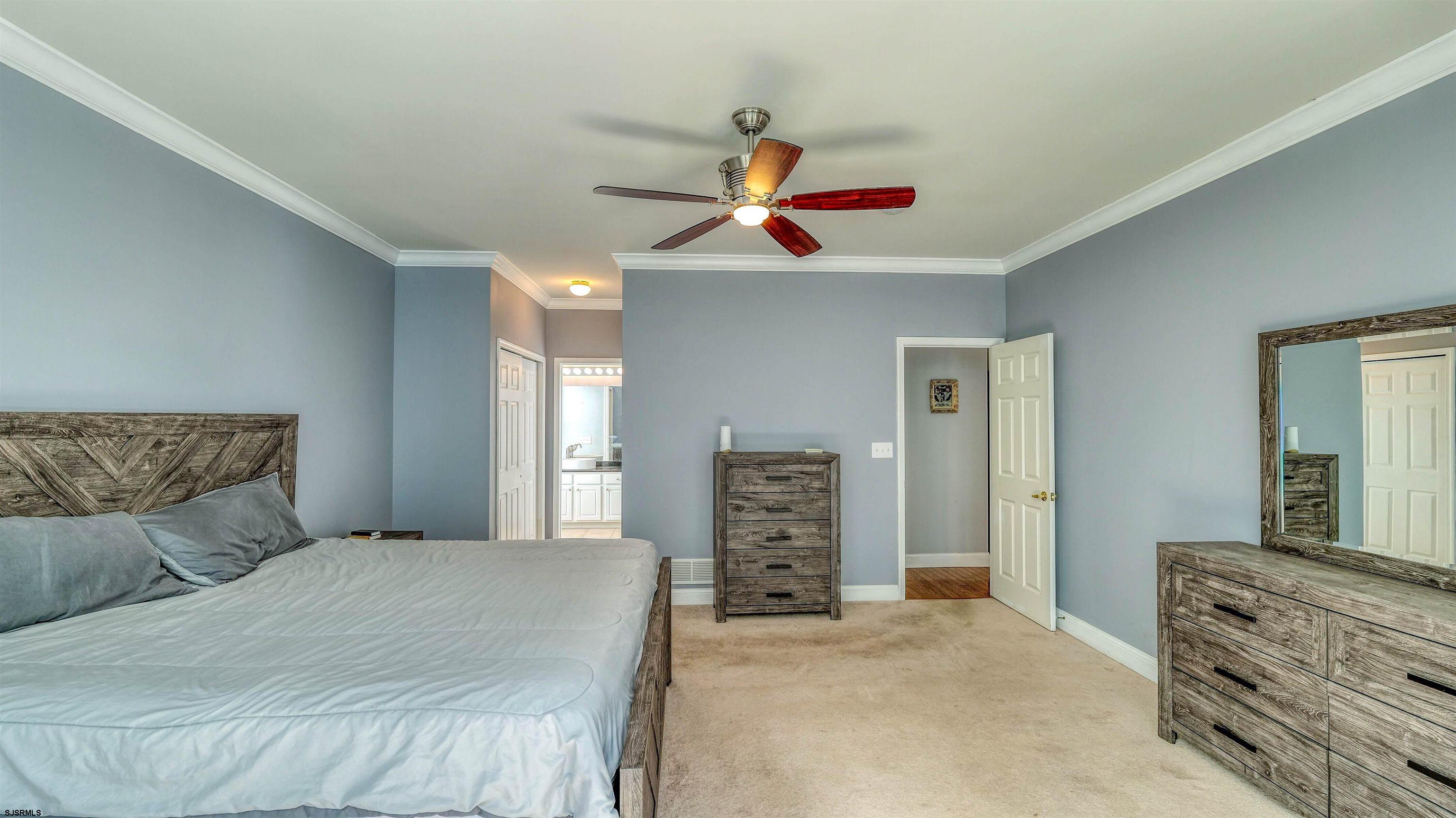 30 Wordsworth Street Galloway Township, NJ 08205 - Photo 17 of 30 a bedroom with a bed and a chandelier