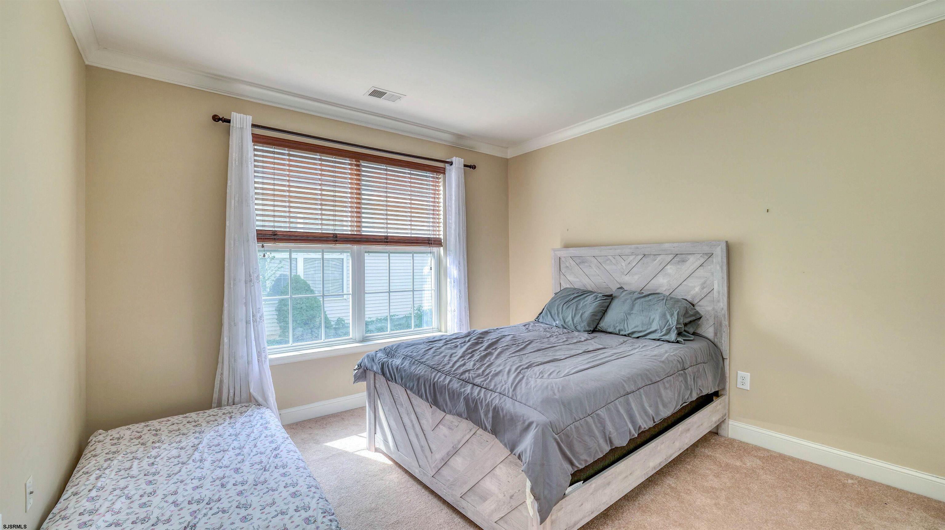 30 Wordsworth Street Galloway Township, NJ 08205 - Photo 19 of 30 a bedroom with a large bed and a window