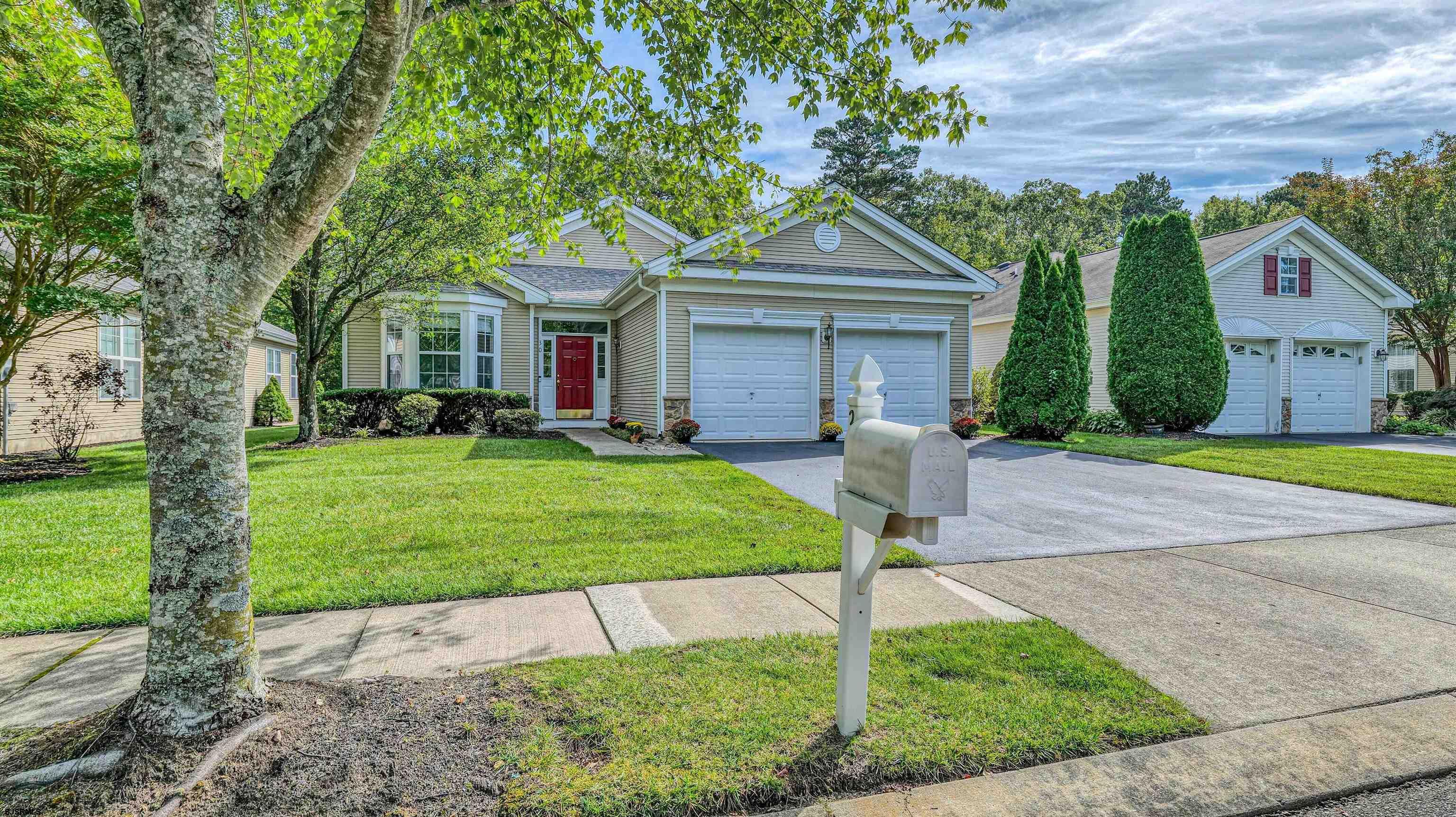 30 Wordsworth Street Galloway Township, NJ 08205 - Photo 29 of 30 a front view of a house with a yard and garage