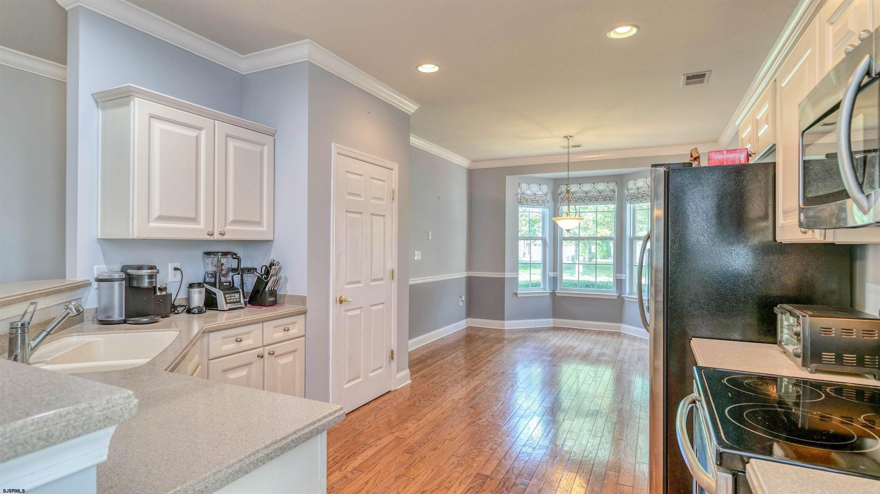 30 Wordsworth Street Galloway Township, NJ 08205 - Photo 7 of 30 a kitchen with stainless steel appliances a sink a stove and a refrigerator