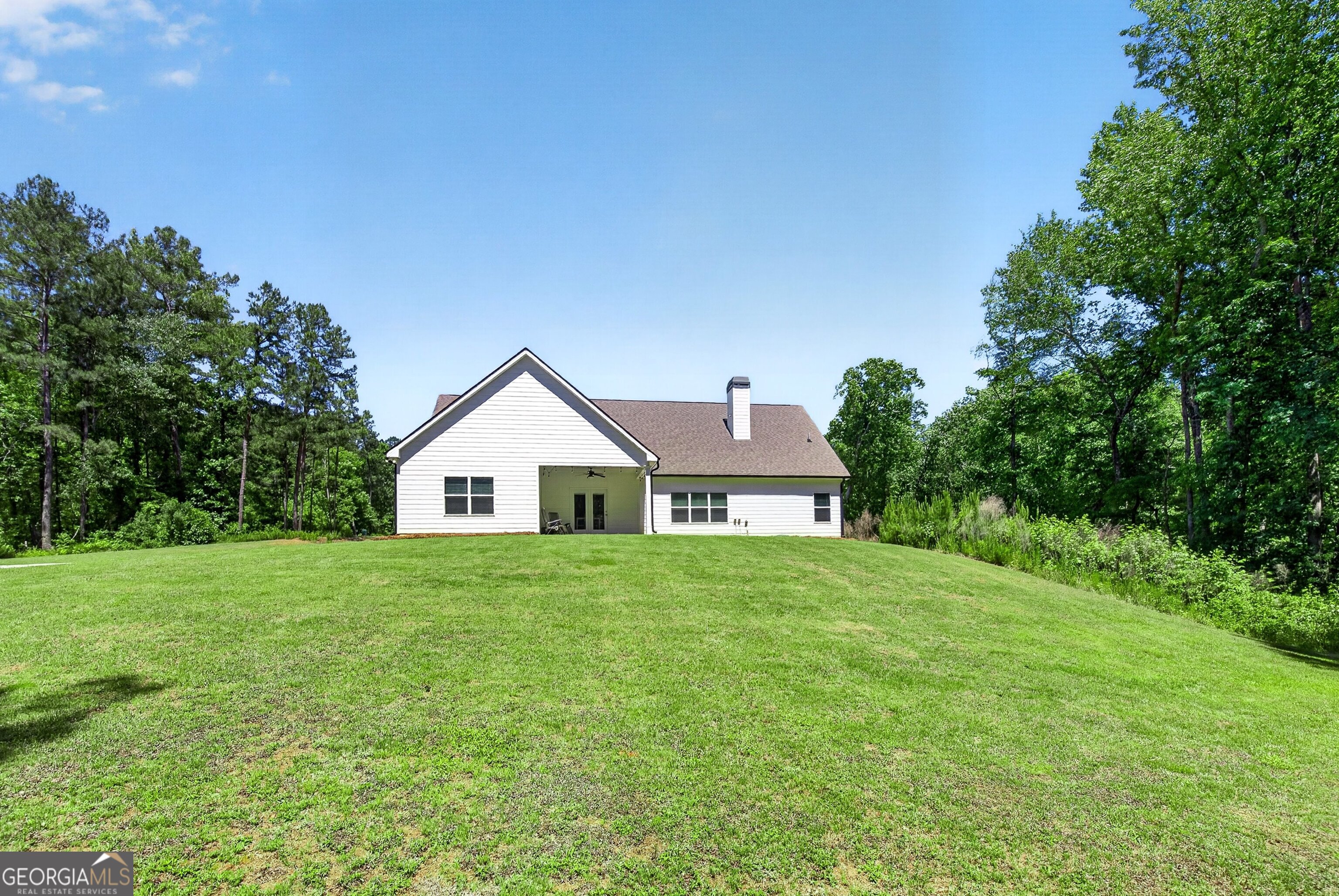 1764 Luther Bailey Road Senoia, GA 30276 - Photo 42 of 63 a house with huge green field in front of it
