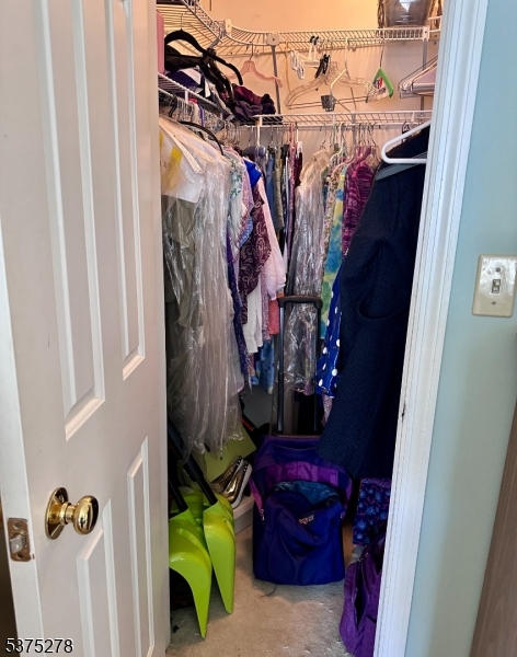70 Boulder Run Road Paterson, NJ 07501 - Photo 8 of 29 a view of walk in closet with clothes