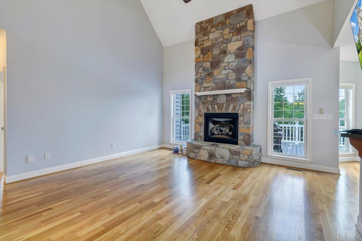 911 Police Tower Road Appomattox, VA 24522 - Photo 3 of 55 a view of an empty room with wooden floor and a fireplace
