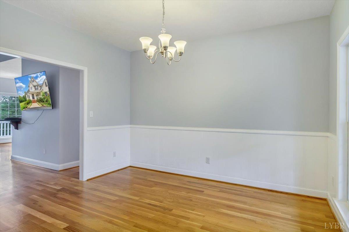 911 Police Tower Road Appomattox, VA 24522 - Photo 6 of 55 a view of an empty room with wooden floor