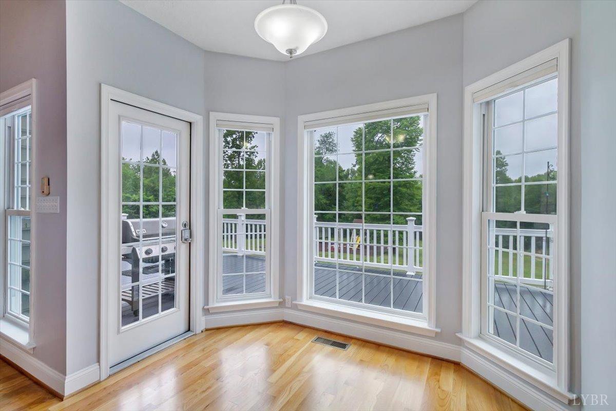 911 Police Tower Road Appomattox, VA 24522 - Photo 8 of 55 a view of a big room with wooden floor and windows