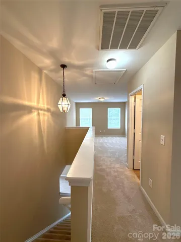 a view of a livingroom with furniture and chandelier