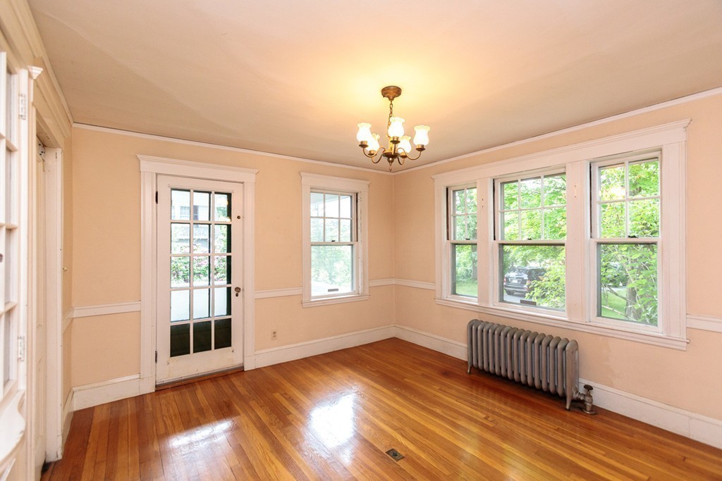 271 Glen Road Weston, MA 02493 - Photo 4 of 21 a view of an empty room with wooden floor and a window
