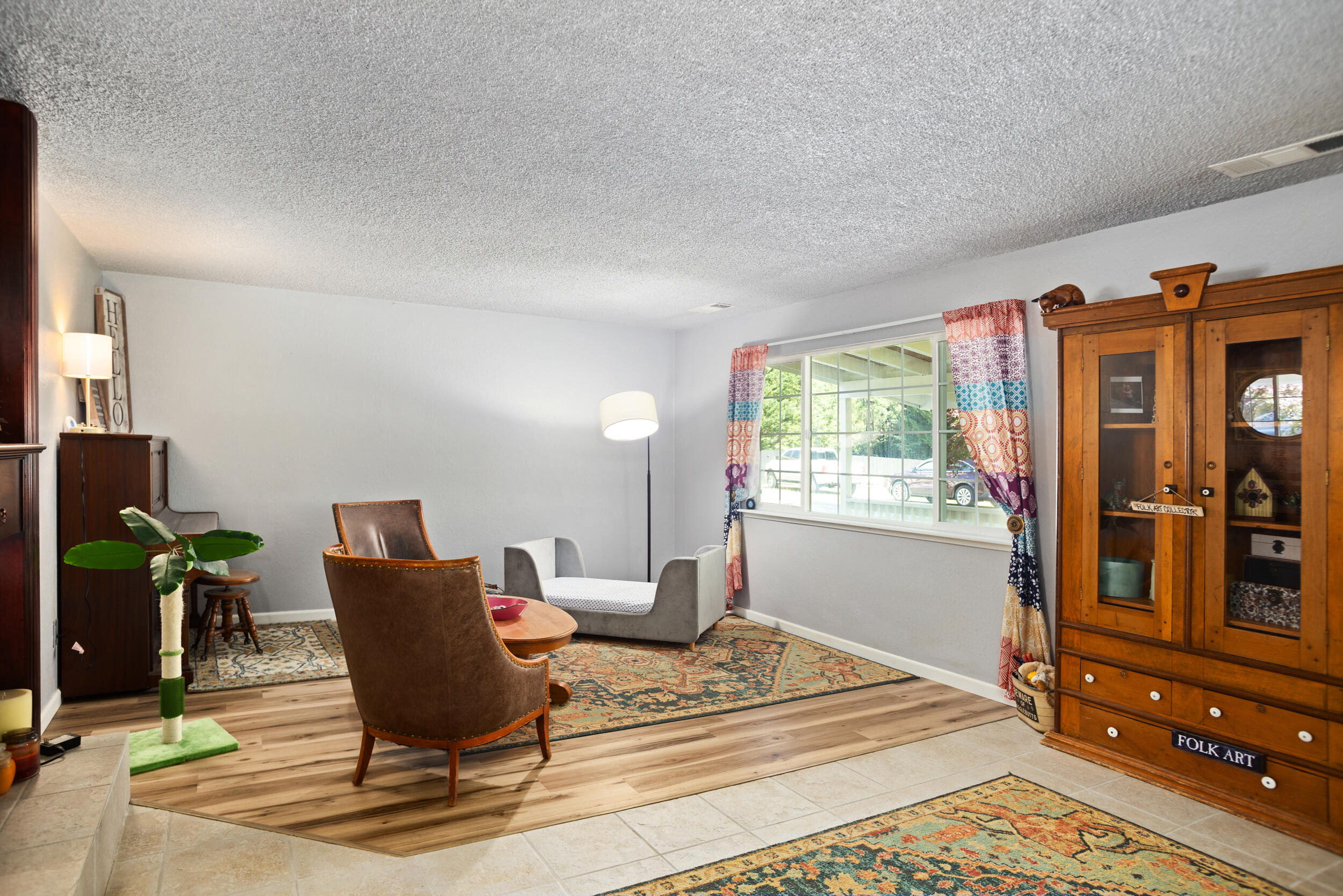 255 Queens Branch Road Rogue River, OR 97537 - Photo 7 of 60 a living room with furniture a window and bookshelf