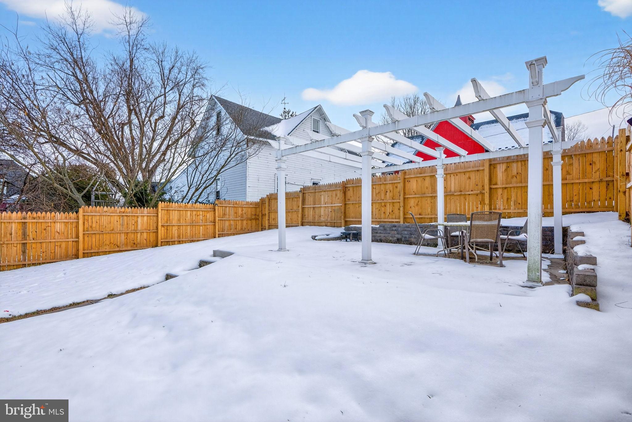 205 South And K Street Spring City, PA 19475 - Photo 7 of 36 Snowy backyard oasis with pergola charm.
