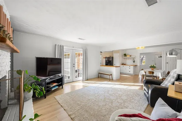 a kitchen with stainless steel appliances a stove refrigerator sink and microwave