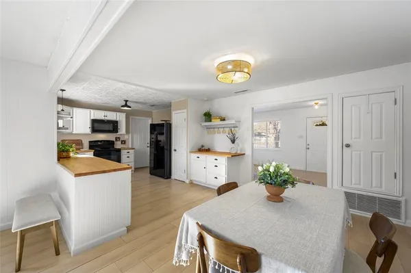 a kitchen with a sink stove and microwave