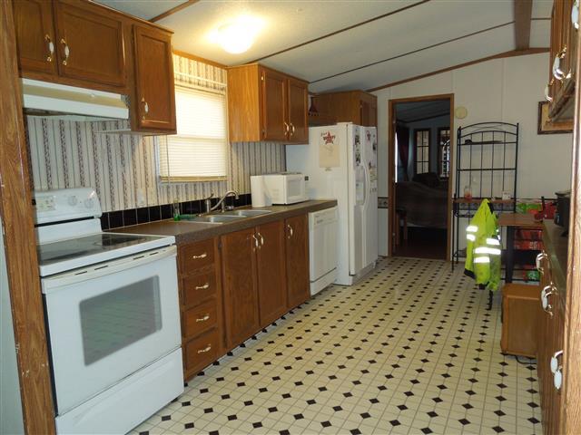 1818 Church Road Clarksville, TN 37040 - Photo 8 of 20 Nice sized eat-in kitchen; range, dishwasher, & refrigerator to remain.