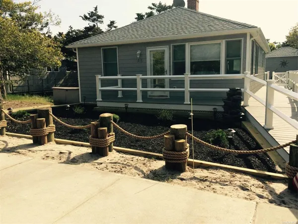 a front view of a house with parking area