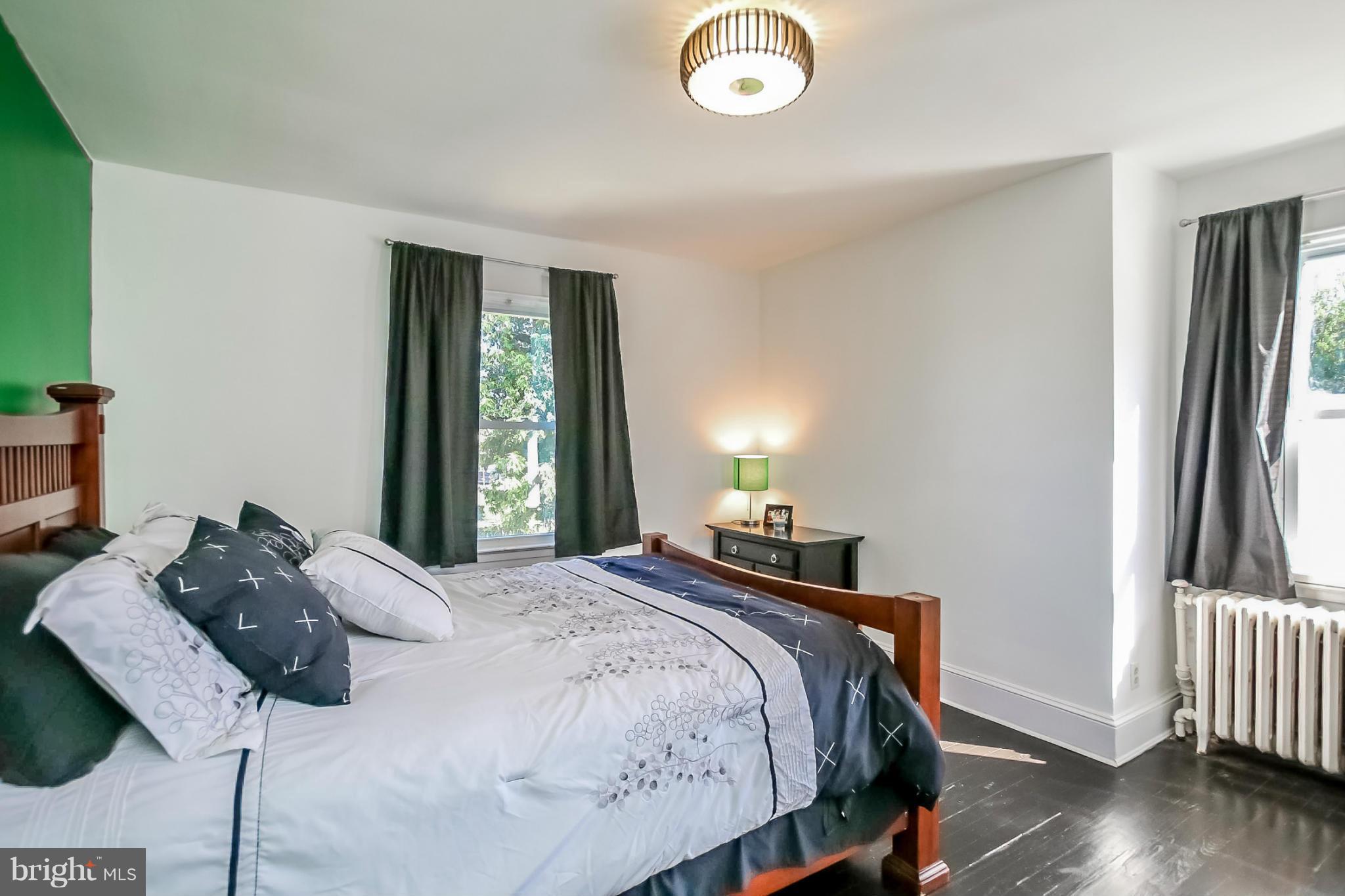 814 Dorchester Road Baltimore, MD 21229 - Photo 15 of 30 a bedroom with a bed and a window