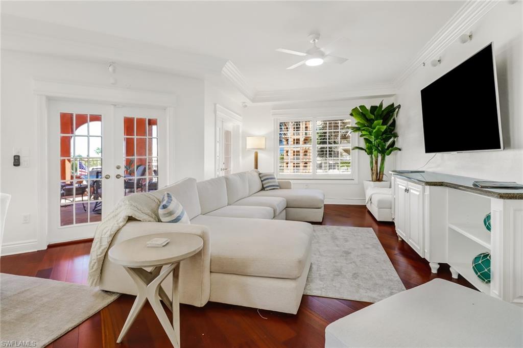 451 Bayfront Place, Unit 5307 Naples, FL 34102 - Photo 9 of 28 a living room with furniture and a flat screen tv