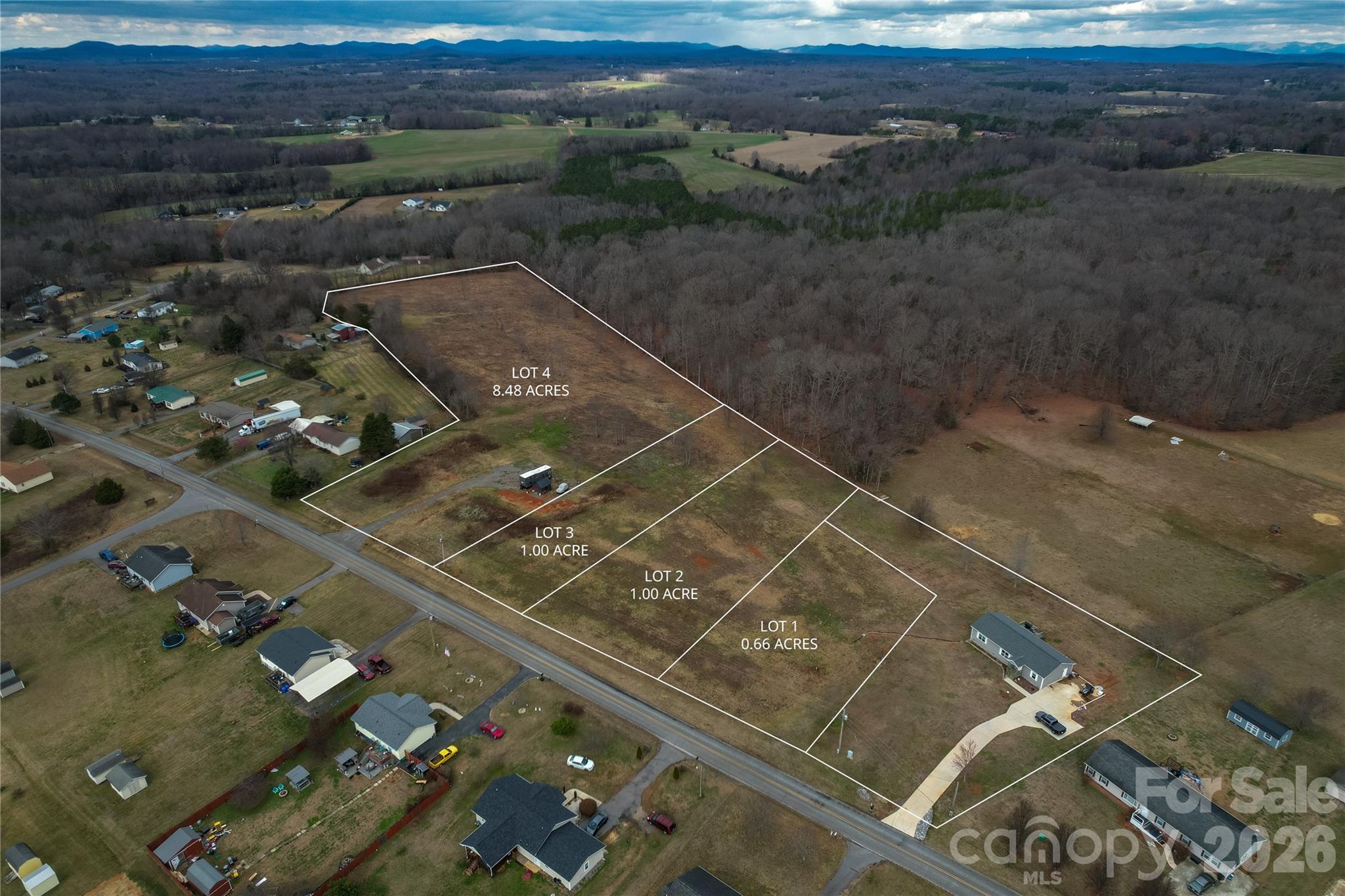 144 Speaks Road, Unit 5 Olin, NC 28660 - Photo 3 of 4 an aerial view of residential houses with outdoor space