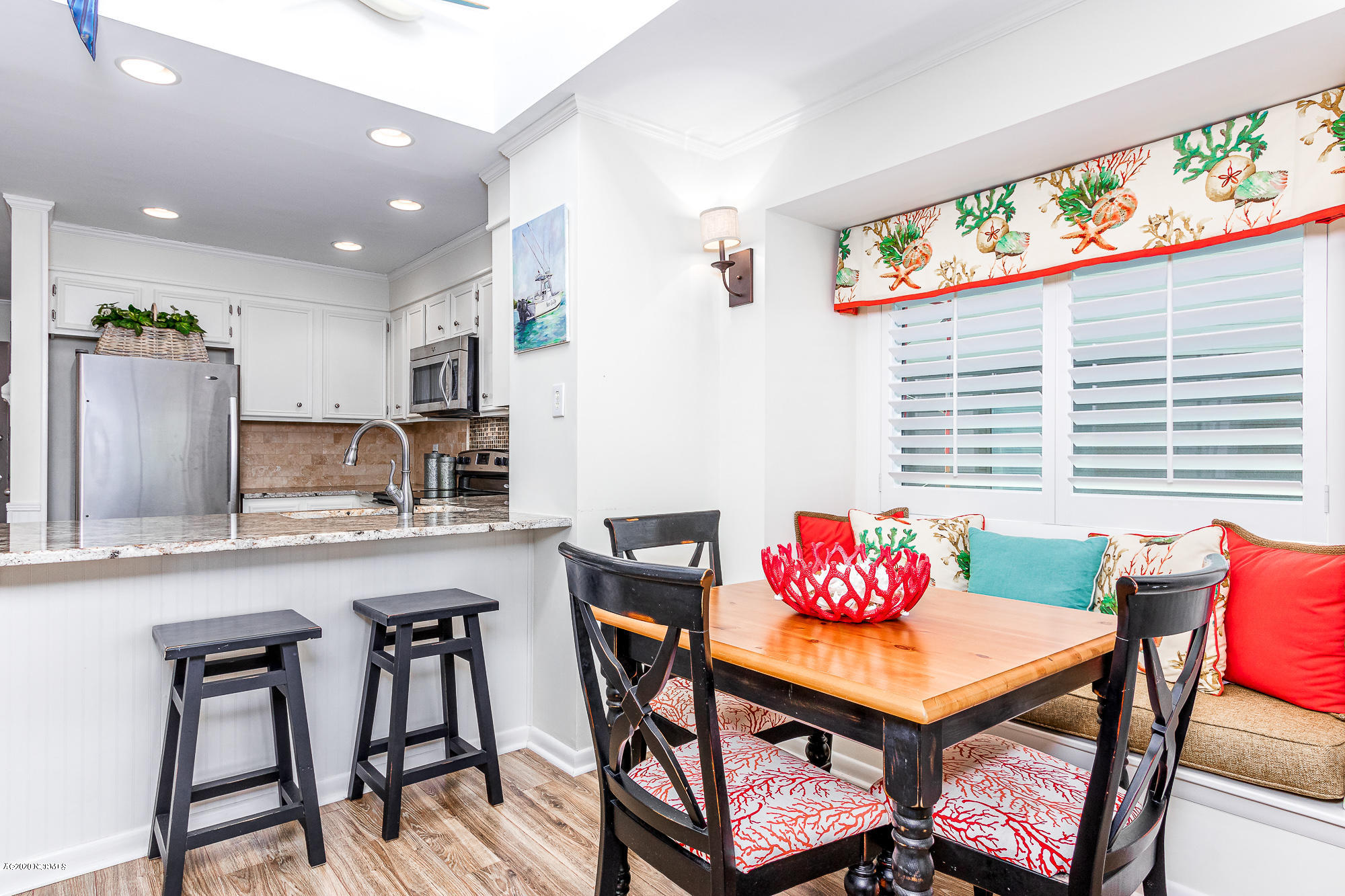 2402 West Fort Macon Road, Unit 306G Atlantic Beach, NC 28512 - Photo 9 of 39 Dining area w/ window seat