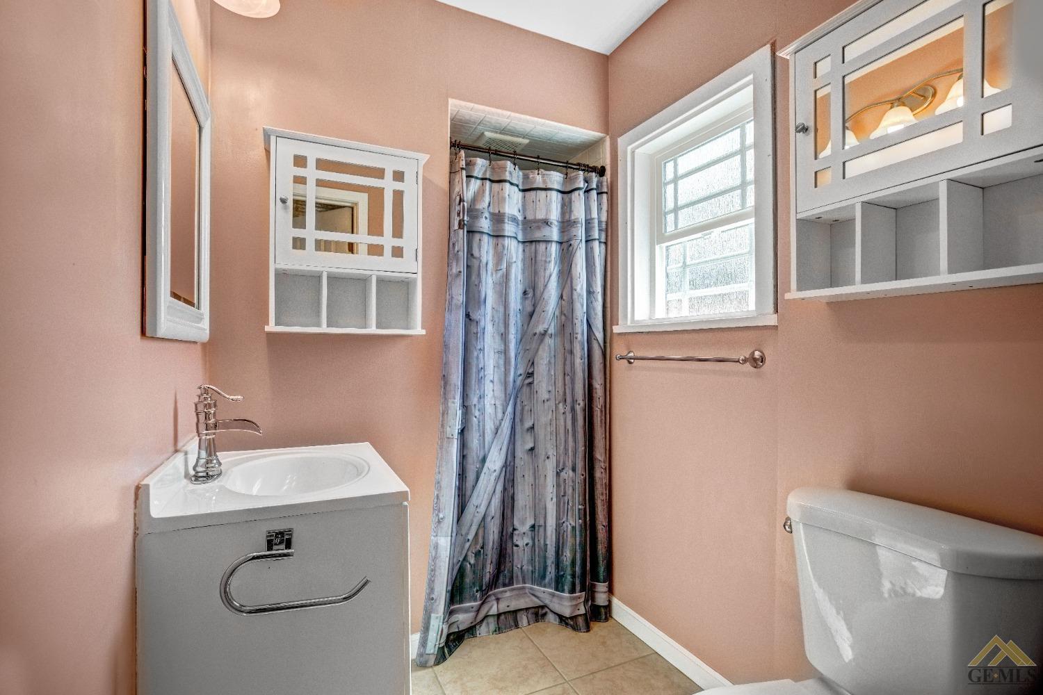 Undisclosed Address Taft, CA 93268 - Photo 20 of 24 a bathroom with a sink a toilet and a window