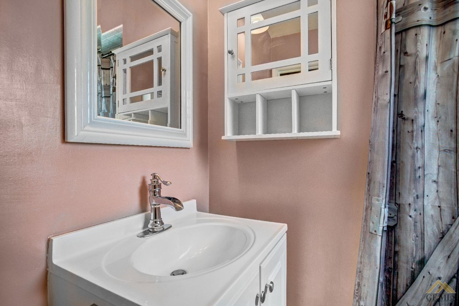 Undisclosed Address Taft, CA 93268 - Photo 21 of 24 a bathroom with a sink and a mirror