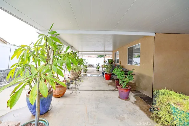a vase of flowers sitting on a floor